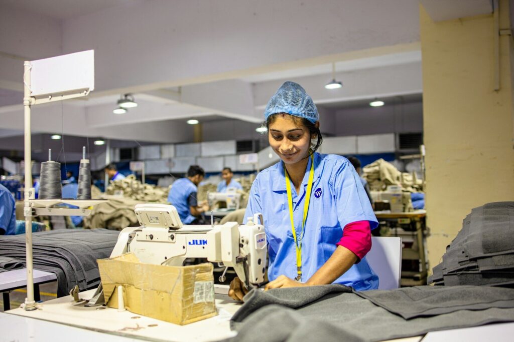 Woman sews in a garment factory.